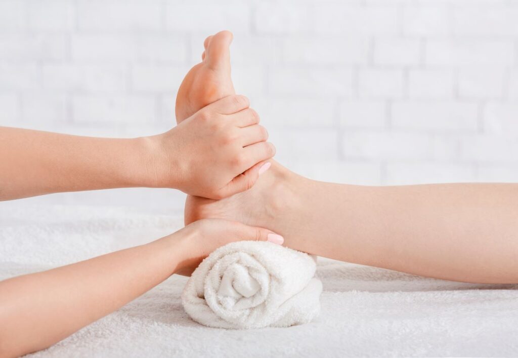 foot massage on white background